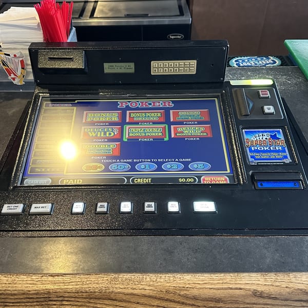 A close-up of a Super Star Poker video game machine at Legends Grill Sports & Spirits.